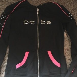 Bebe sweater that is black with pink details